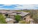 Attractive single-story home with a neutral color palette, a two-car garage, desert landscaping, and a private, walled backyard at 12381 S 182Nd Dr, Goodyear, AZ 85338
