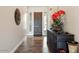 Inviting foyer with stylish console table, a decorative mirror, and neutral paint at 12381 S 182Nd Dr, Goodyear, AZ 85338