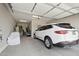Spacious two car garage with an interior door to the home, featuring a light gray painted interior at 12381 S 182Nd Dr, Goodyear, AZ 85338