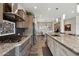 Well-equipped kitchen with stainless steel appliances, granite countertops, and a functional layout perfect for cooking and entertaining at 12381 S 182Nd Dr, Goodyear, AZ 85338