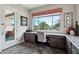 Bright office space with built-in desk, backyard views, and natural light, creates a perfect work-from-home environment at 12381 S 182Nd Dr, Goodyear, AZ 85338