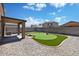 Wonderful backyard with a putting green, perfect for the golf enthusiast and outdoor relaxation at 12621 W Willow Ave, El Mirage, AZ 85335