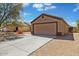 Charming single-story home with a two-car garage and low-maintenance desert landscaping at 12621 W Willow Ave, El Mirage, AZ 85335