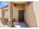 Welcoming front entrance featuring a secure screen door and covered porch area at 12621 W Willow Ave, El Mirage, AZ 85335