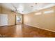 Inviting living room with tile floors, large windows, and neutral wall paint at 12621 W Willow Ave, El Mirage, AZ 85335
