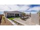 Spacious backyard with pavers, seating, and artificial turf at 12708 W Corona Ave, Avondale, AZ 85323