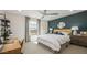 Bright bedroom with a desk, ceiling fan, and natural light at 12708 W Corona Ave, Avondale, AZ 85323