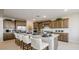 Spacious kitchen with a large island, stainless steel appliances, and ample counter space at 12708 W Corona Ave, Avondale, AZ 85323