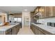 Gourmet kitchen showcasing stainless steel appliances, ample cabinet space, and a convenient walk-in pantry for optimal storage at 12708 W Corona Ave, Avondale, AZ 85323