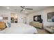 Spacious bedroom with a neutral color palette, showcasing access to an en-suite bathroom and a well-organized walk-in closet at 12708 W Corona Ave, Avondale, AZ 85323
