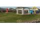 Park playground area with covered seating and picnic tables at 12708 W Corona Ave, Avondale, AZ 85323