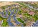 An aerial view showcasing parking, tennis courts, and lush greenery within the community at 12972 W Kokopelli Dr, Peoria, AZ 85383