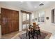 Cozy breakfast nook has sliding doors that lead to the outdoor living area and pool at 12972 W Kokopelli Dr, Peoria, AZ 85383