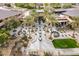 An overhead shot of a stylish courtyard featuring outdoor seating, fire pits, and lush greenery at 12972 W Kokopelli Dr, Peoria, AZ 85383