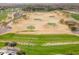 Spacious golf course with trees and sand traps in a scenic golf community at 12972 W Kokopelli Dr, Peoria, AZ 85383