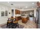 Large kitchen features granite countertops, tile floors, stainless appliances and a nearby breakfast nook at 12972 W Kokopelli Dr, Peoria, AZ 85383