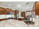 Bright kitchen with granite counters, stainless steel appliances, tile backsplash, and a breakfast bar at 12972 W Kokopelli Dr, Peoria, AZ 85383