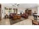 Spacious living room with tile flooring, plantation shutters, and comfortable furnishings at 12972 W Kokopelli Dr, Peoria, AZ 85383