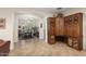 Open floorplan: A custom built-in cabinet and desk combination is next to the dining room at 12972 W Kokopelli Dr, Peoria, AZ 85383