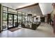 Welcoming lobby with comfortable seating, large windows, and views of outdoor greenery at 12972 W Kokopelli Dr, Peoria, AZ 85383