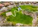 Overhead view of a park with a playground, basketball court, walking path, and surrounding homes at 12972 W Kokopelli Dr, Peoria, AZ 85383