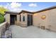 Private outdoor patio with seating and decorative art at 12972 W Kokopelli Dr, Peoria, AZ 85383