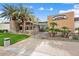 V's Taproom featuring a combination of stone and stucco, palm trees, and outdoor landscaping at 12972 W Kokopelli Dr, Peoria, AZ 85383