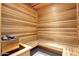 Sauna room featuring wooden walls, benches, and a rock-filled heater for a relaxing spa experience at 13700 N Fountain Hills Blvd # 155, Fountain Hills, AZ 85268