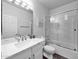 Bathroom featuring a sink, toilet, and shower with glass doors at 14000 N 94Th St # 1008, Scottsdale, AZ 85260