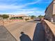 Inviting community entrance with stone bridge and meticulously maintained landscaping at 14000 N 94Th St # 1008, Scottsdale, AZ 85260