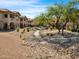 Serene community grounds with walking path and well maintained desert landscaping at 14000 N 94Th St # 1008, Scottsdale, AZ 85260
