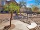 Scenic park area with walking path, seating, lush landscaping, and mature trees at 14000 N 94Th St # 1008, Scottsdale, AZ 85260