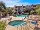 Community pool and spa with ample seating areas, and mature landscaping at 14000 N 94Th St # 1008, Scottsdale, AZ 85260