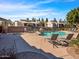 Community pool area with lounge chairs, perfect for relaxation and socializing at 14000 N 94Th St # 1008, Scottsdale, AZ 85260