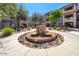 Community courtyard featuring fountain and desert landscaping at 14000 N 94Th St # 1008, Scottsdale, AZ 85260