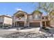 Elegant two-story home with a two-car garage and desert landscaping at 14000 N 94Th St # 1008, Scottsdale, AZ 85260