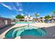 Relaxing hot tub with blue mosaic tiles near the community pool and lounge area at 14000 N 94Th St # 1008, Scottsdale, AZ 85260