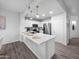 Bright kitchen features stainless steel appliances, a large island, and modern pendant lighting at 14000 N 94Th St # 1008, Scottsdale, AZ 85260
