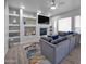 Inviting living room featuring custom built-ins, a cozy fireplace, and stylish decor at 14000 N 94Th St # 1008, Scottsdale, AZ 85260