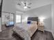 Comfortable main bedroom features a ceiling fan and sliding door closet at 14000 N 94Th St # 1008, Scottsdale, AZ 85260
