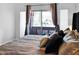Cozy bedroom featuring plush bedding and private balcony access at 14000 N 94Th St # 1008, Scottsdale, AZ 85260