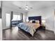 Spacious bedroom features hardwood floors, balcony and ceiling fan at 14000 N 94Th St # 1008, Scottsdale, AZ 85260