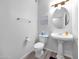 Clean powder room featuring pedestal sink, modern fixtures, and contemporary design at 14000 N 94Th St # 1008, Scottsdale, AZ 85260
