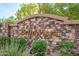 Stone monument sign for Bella Vista is surrounded by foliage at 14000 N 94Th St # 1008, Scottsdale, AZ 85260