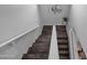 Wooden stairs with white risers offer a stylish transition between floors at 14000 N 94Th St # 1008, Scottsdale, AZ 85260
