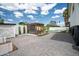 Large backyard with mature landscaping, a gazebo, and a seating area near the pool at 1630 E Minton Dr, Tempe, AZ 85282