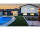 Outdoor living space with a pool, manicured lawn, a modern exterior, and mature landscaping at 1630 E Minton Dr, Tempe, AZ 85282
