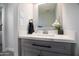 Bright bathroom featuring a grey vanity with white countertop, plus a modern faucet and mirror at 1630 E Minton Dr, Tempe, AZ 85282