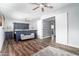 Bright bedroom with a ceiling fan, wood-look floors and doors leading to another room at 1630 E Minton Dr, Tempe, AZ 85282