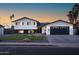 Charming two-story home with manicured lawn, attractive landscaping, and a paved driveway at 1630 E Minton Dr, Tempe, AZ 85282